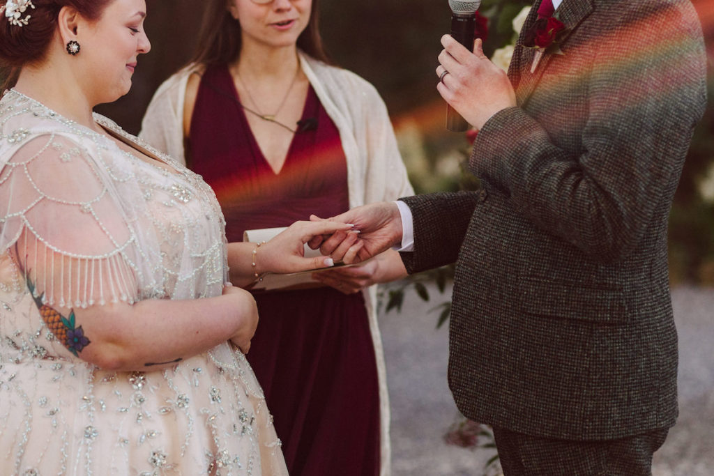 bride and groom exchanging rings at Deer Park Villa