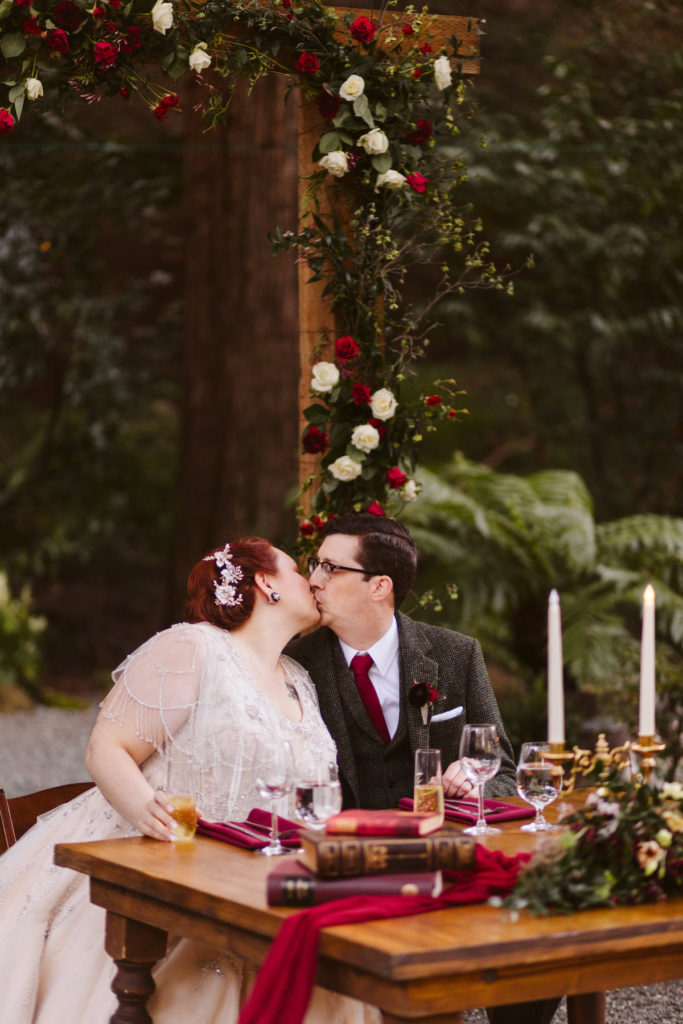 Couple kisses at Sweetheart Table