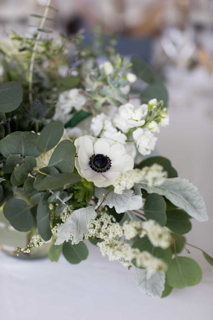 close up of green and white flower centerpiece
