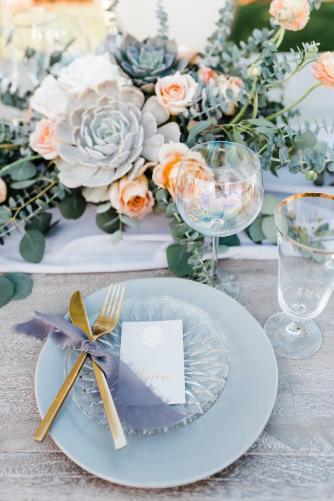 Tablescape design with gold flatware, gray plates and succulent centerpiece