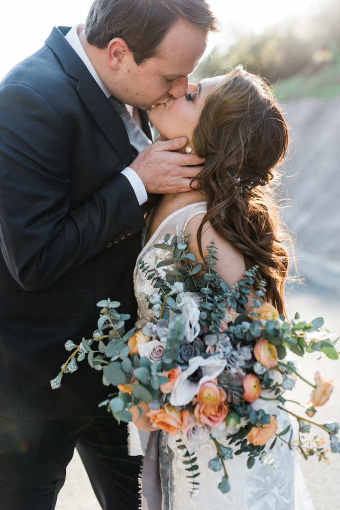 bride and groom kiss during sunset photos at Calistoga Ranch