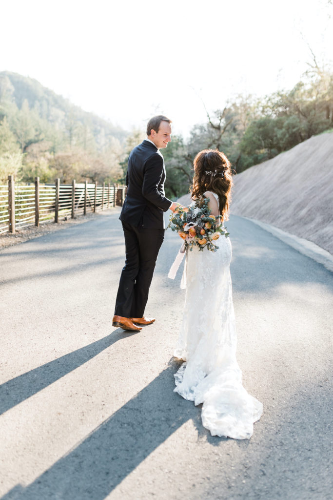 bride and groom walk during sunset photos at Calistoga Ranch